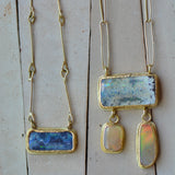 Two Australian boulder opal necklaces, one blue, one pale yellow and beige, with 18k and 22k gold handcrafted chains and settings