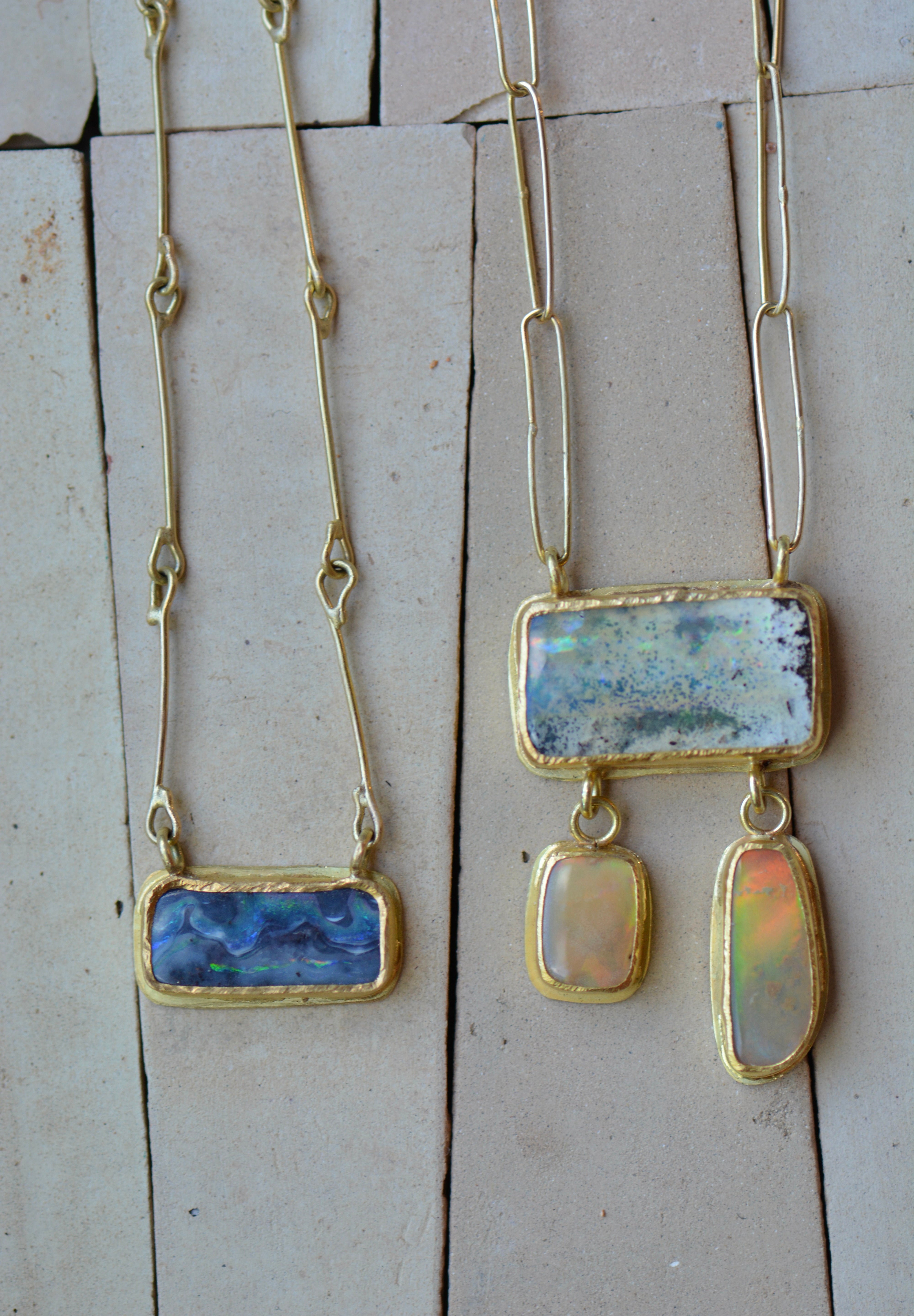 Two Australian boulder opal necklaces, one blue, one pale yellow and beige, with 18k and 22k gold handcrafted chains and settings