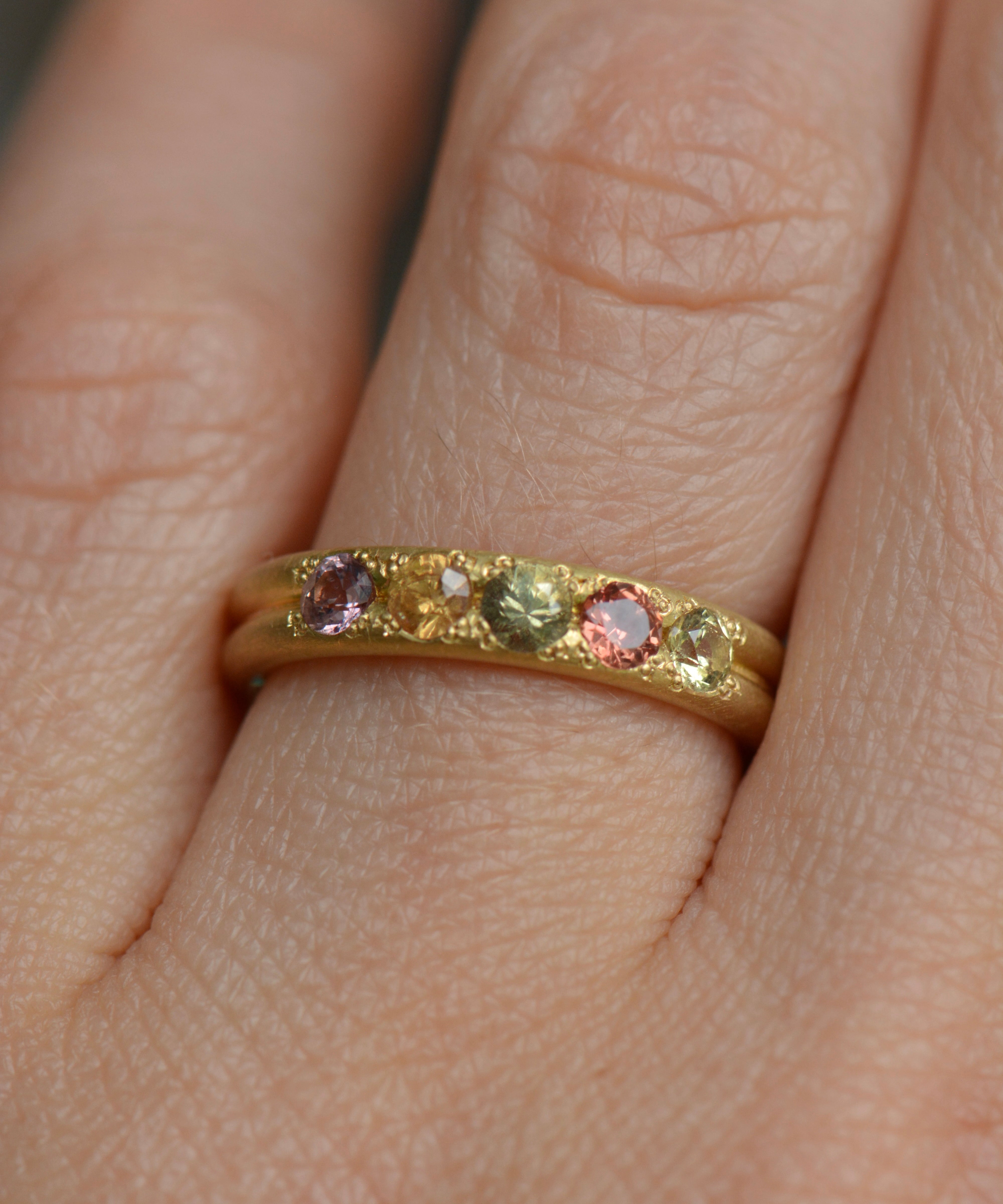 Handcrafted five stone sapphire ring band in 18k Fairmined gold, ethical jewellery and responsibly sourced materials.