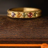 Handcrafted five stone sapphire ring band in 18k Fairmined gold, ethical jewellery and responsibly sourced materials.