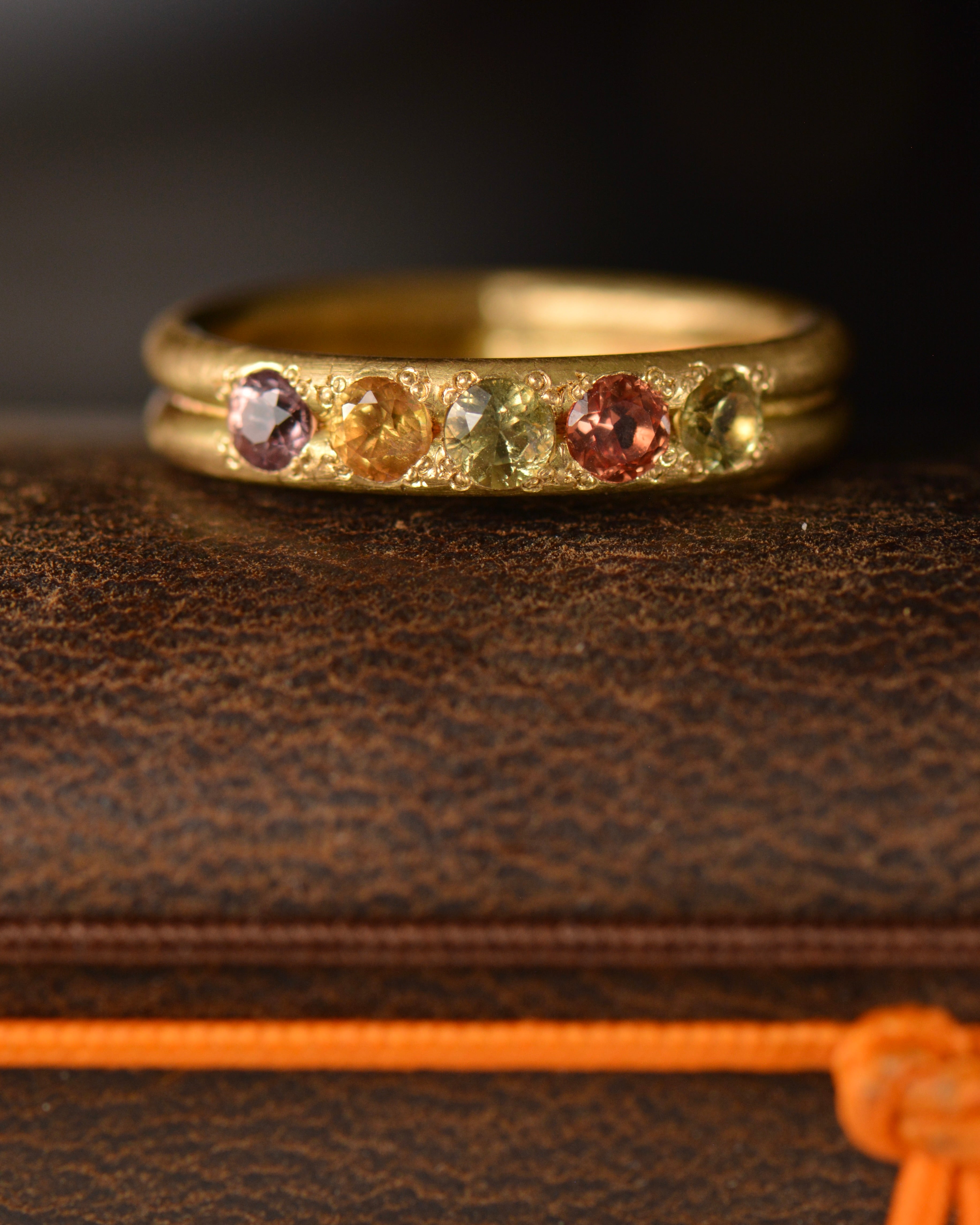 Handcrafted five stone sapphire ring band in 18k Fairmined gold, ethical jewellery and responsibly sourced materials.