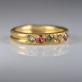 Handcrafted five stone sapphire ring band in 18k Fairmined gold, ethical jewellery and responsibly sourced materials.