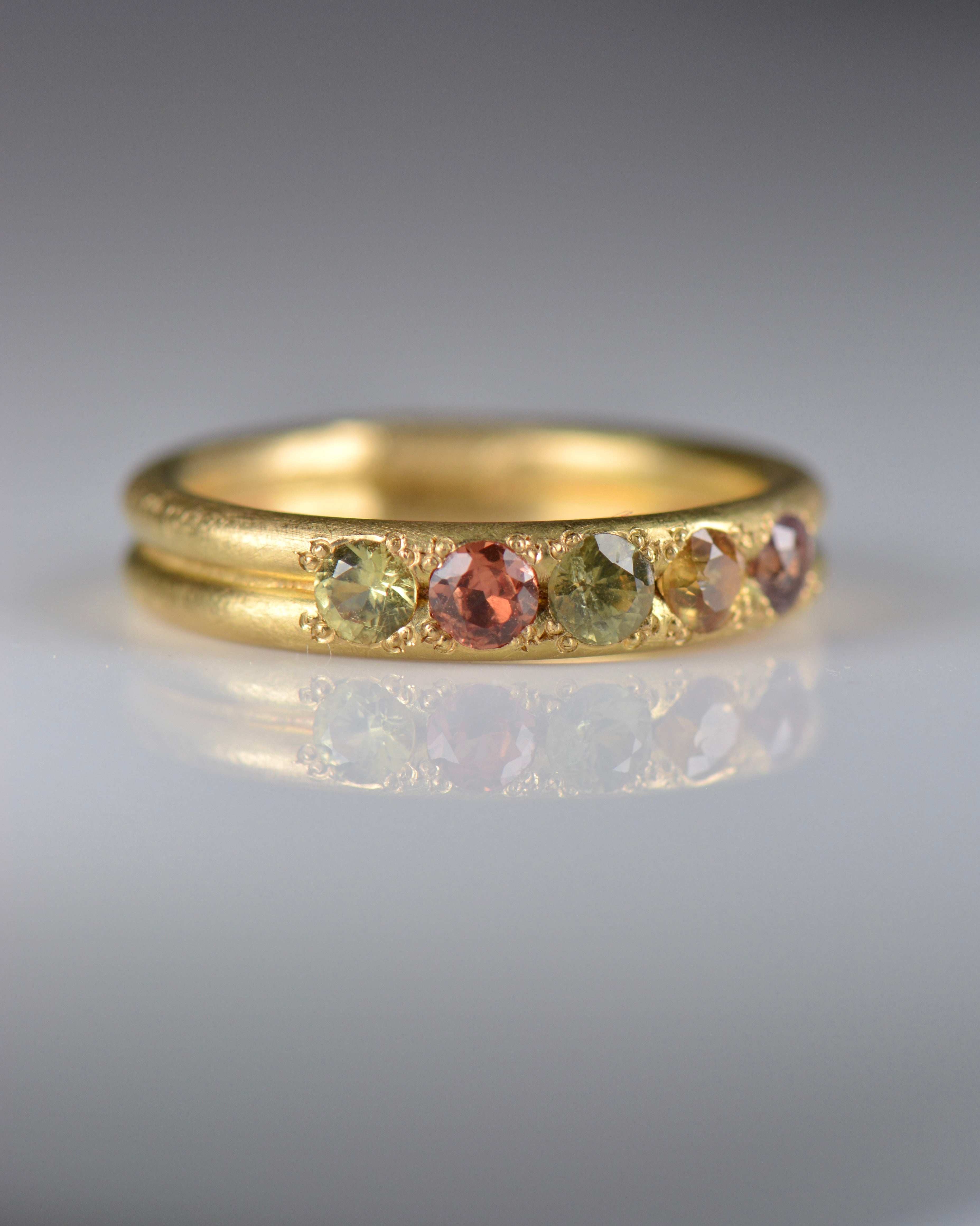 Handcrafted five stone sapphire ring band in 18k Fairmined gold, ethical jewellery and responsibly sourced materials.
