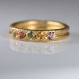 Handcrafted five stone sapphire ring band in 18k Fairmined gold, ethical jewellery and responsibly sourced materials.