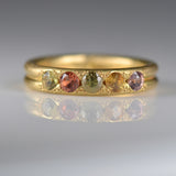 Handcrafted five stone sapphire ring band in 18k Fairmined gold, ethical jewellery and responsibly sourced materials.