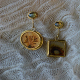 Dendritic agate and chrysoberyl earrings on gauze backdrop