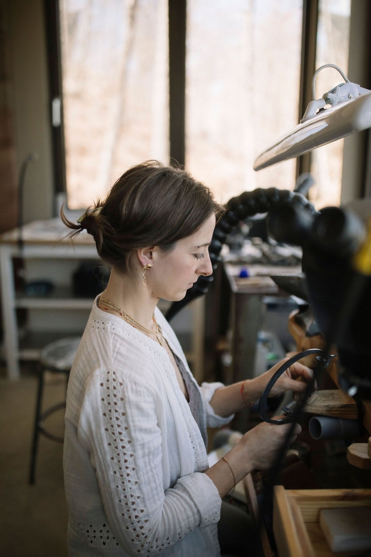 Lori Francescutti working at her jewellers bench in her Haliburton studio