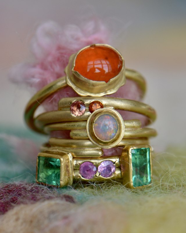 Rainbow stack of one-of-a-kind gold rings